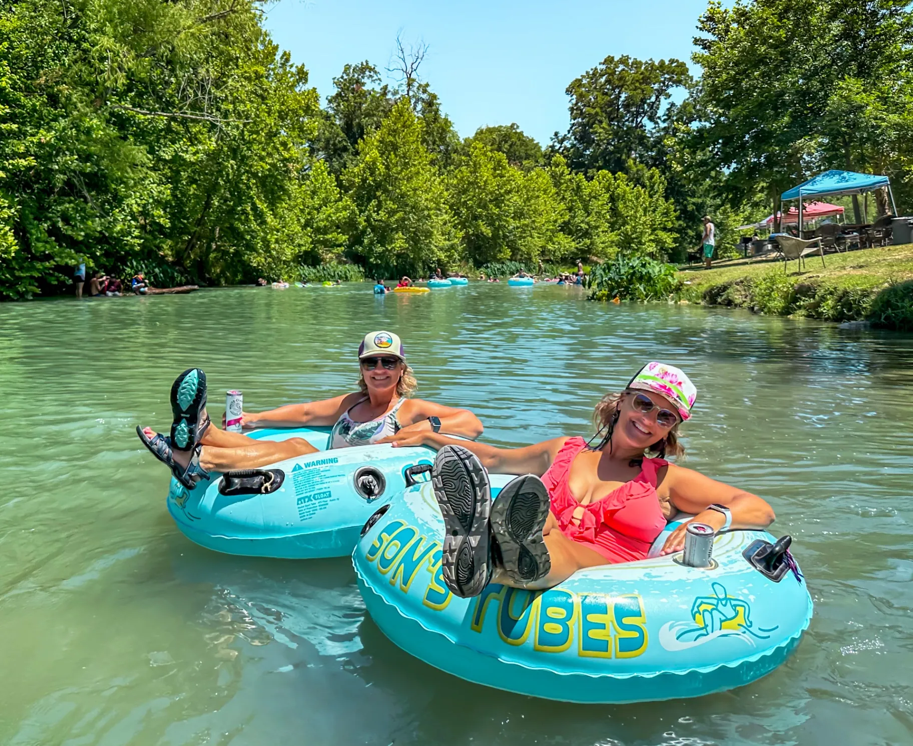Family enjoying San Marcos River tubing at Son's River Ranch