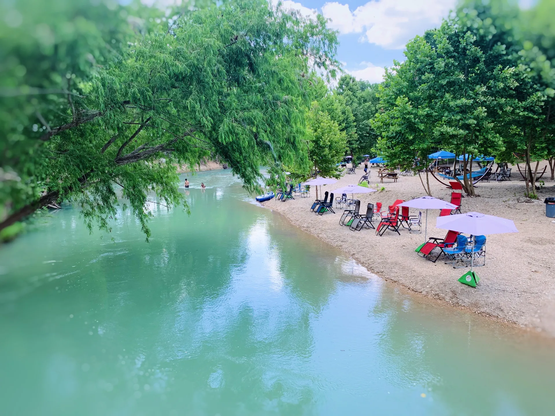 Private river access with calm blue water at Son's River Ranch