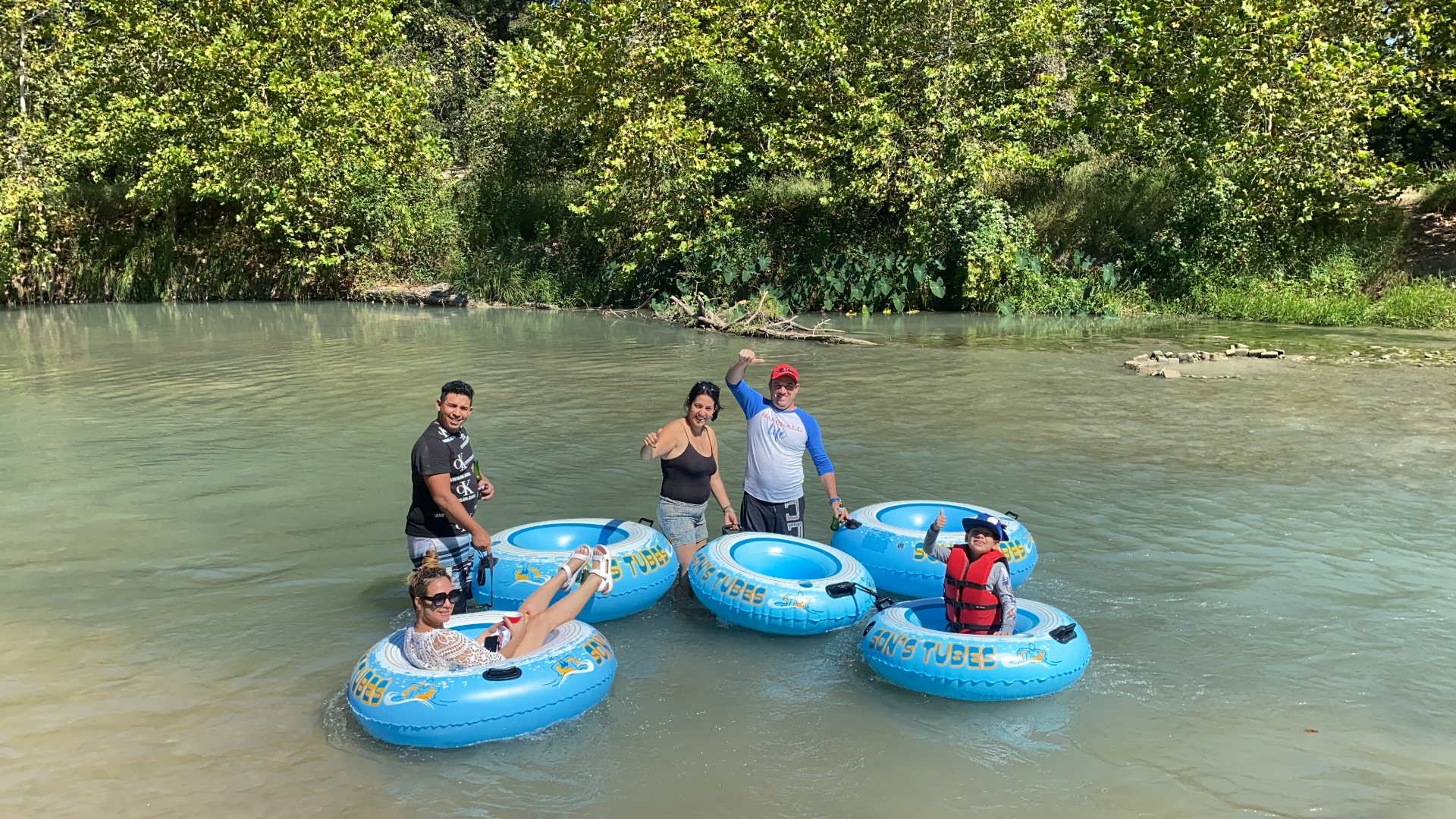 Family having fun tubing together