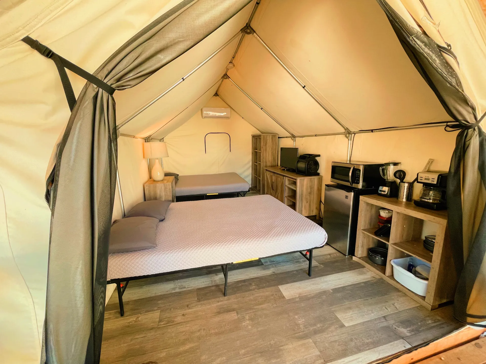 Glamping cabin interior with comfortable beds